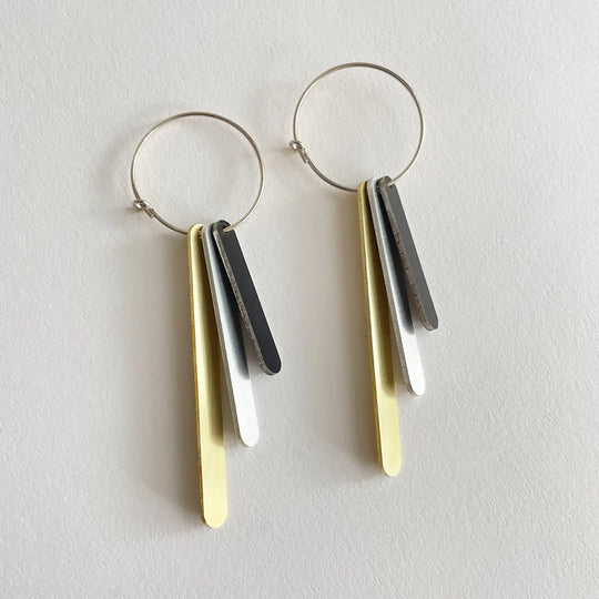 Capsule drop earrings by Tom Pigeon