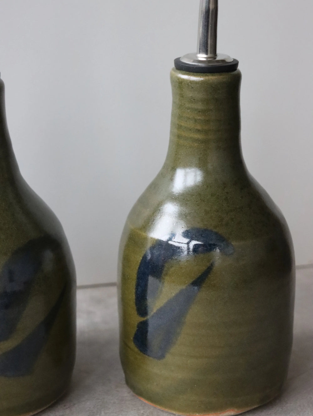 Oil Pourer in Moss and Oxide Brushwork by Hannah Burgess