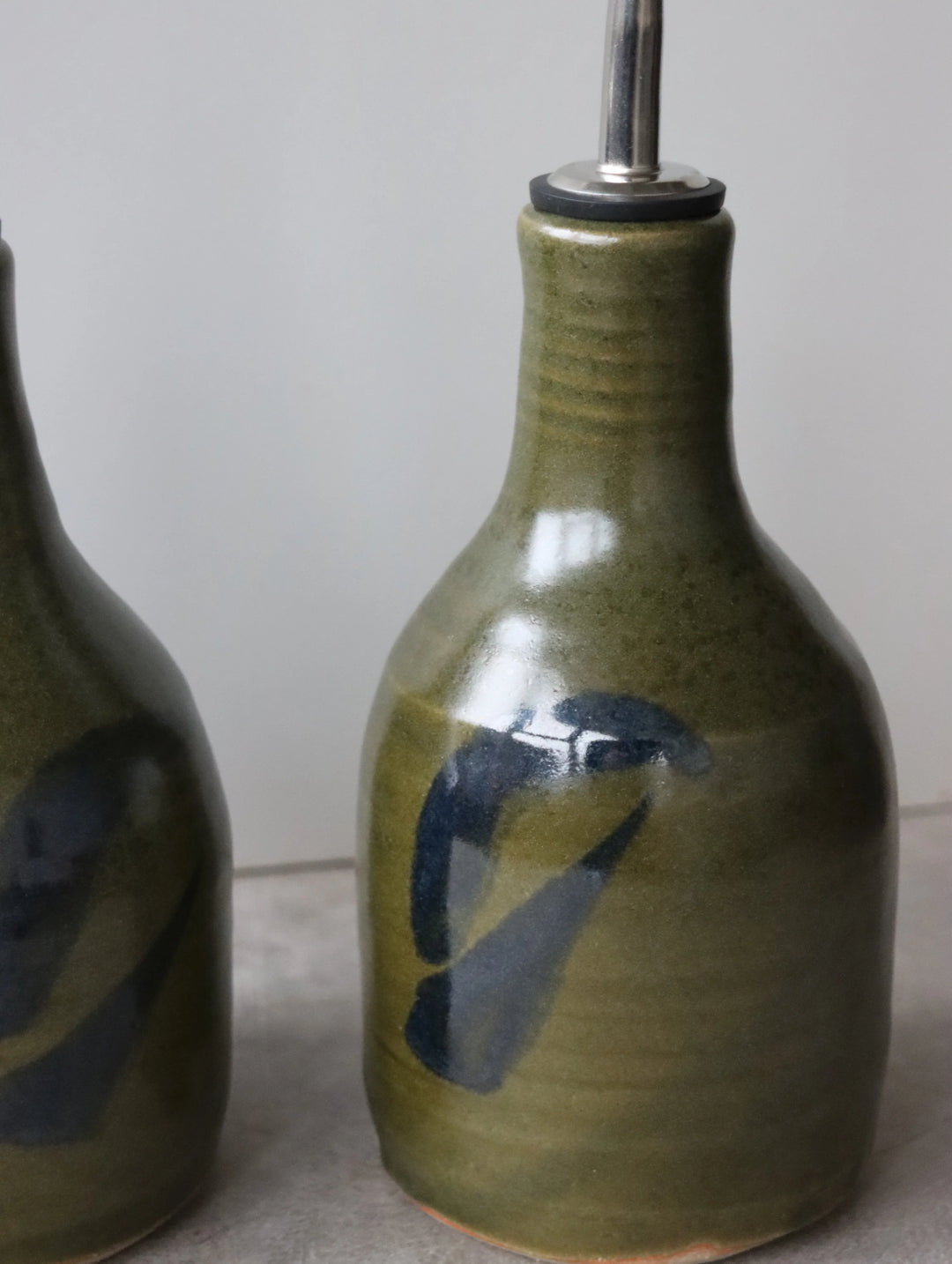 Oil Pourer in Moss and Oxide Brushwork by Hannah Burgess