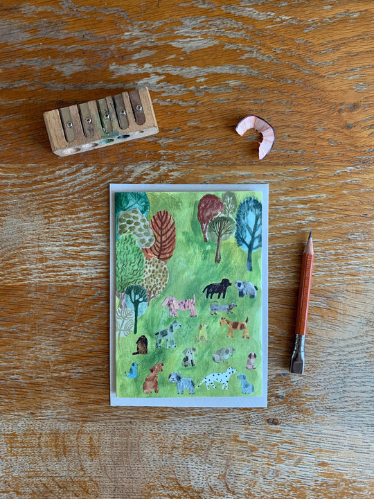Dogs in the Park Greetings Card by Nicola Clarke
