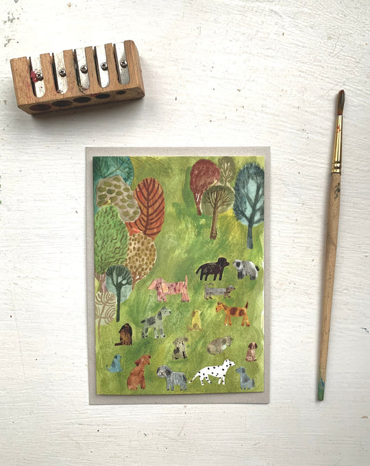 Dogs in the Park Greetings Card by Nicola Clarke